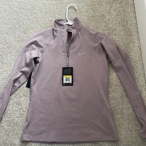 Women’s Nike Half Zip in a light purple.